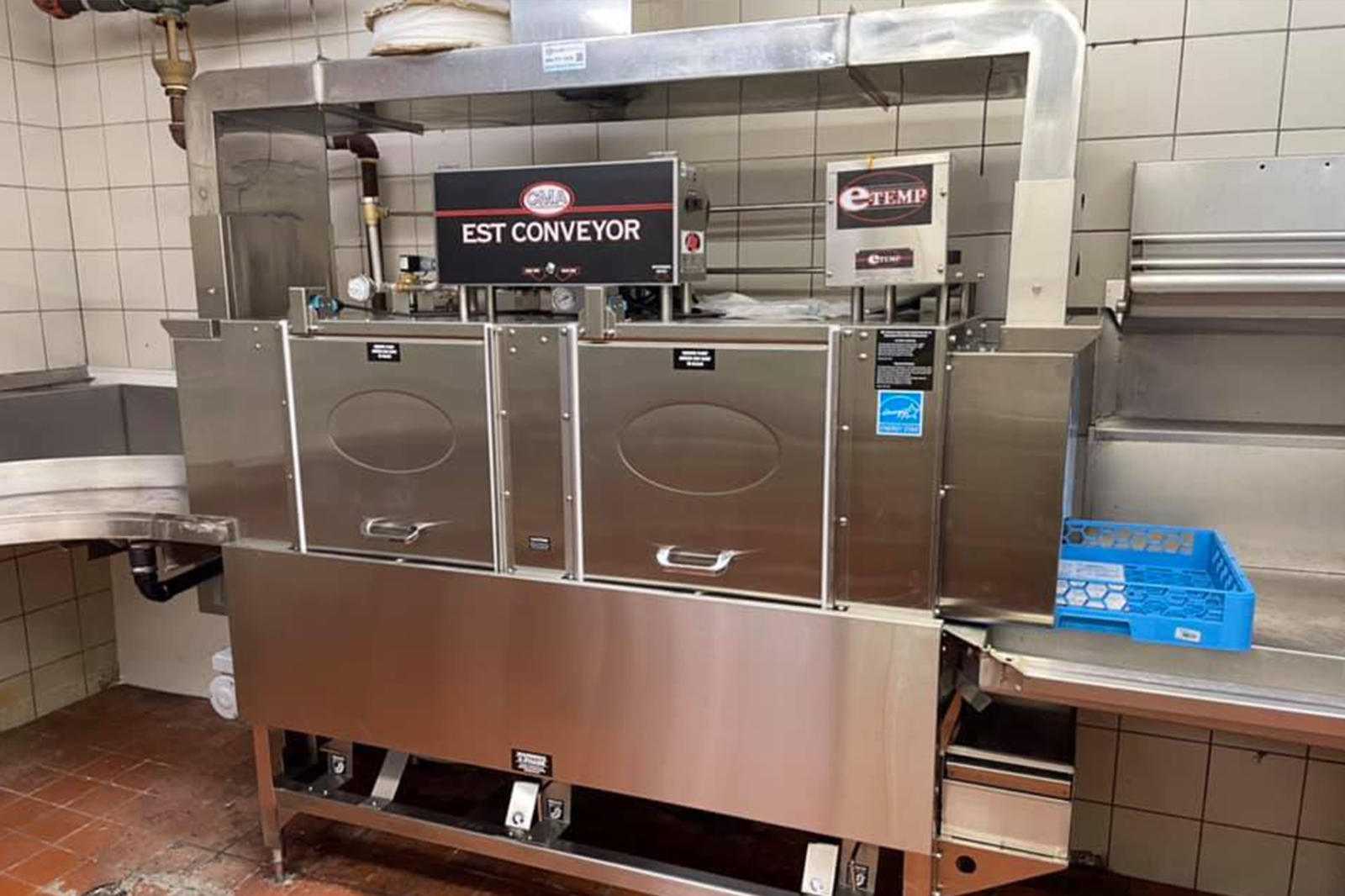 Large stainless steel conveyor dishwasher system built for high-volume restaurant and institutional kitchens.